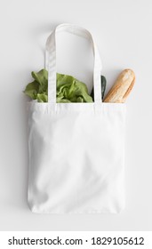 White Tote Bag Mockup With Groceries On A White Table.