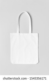 White Tote Bag Mockup On A Grey Background.