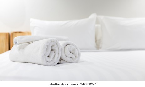 White Towel On Bed In Guest Room For Hotel Customer.