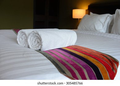 White Towel On The Bed In Relaxation Bedroom Of Luxury Boutique Hotel