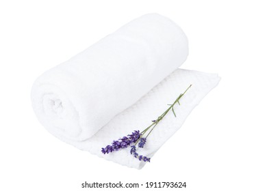 White towel and a sprig of lavender - isolated. A rolled towel and a lavender flower - aromatherapy