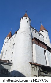 The white towers of the Thun castle (Schloss Thun) in Switzerland, against the blue sky - Shutterstock ID 2141899765