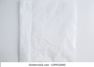 White Translucent Crumpled Paper On A White Background. Top View.