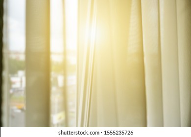 white transparent window curtain soft focus, light through blind illuminate bedroom in early morning