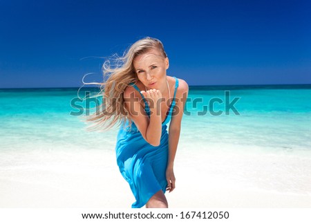 Similar – Young, slender, long-legged woman on a Baltic beach in a summer dress