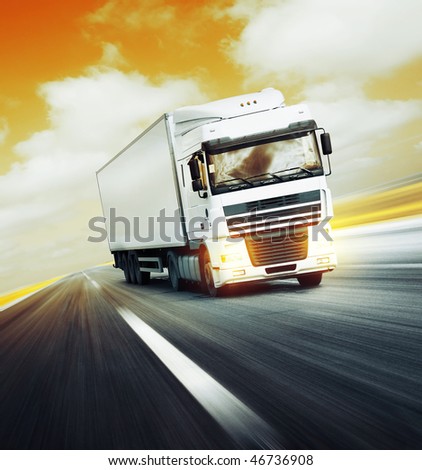 White truck on asphalt road under red abstract sky with clouds