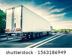 White truck on german highway with slight motion blur