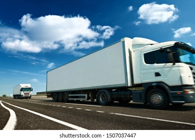 White truck is on highway - business, commercial, cargo transportation concept
