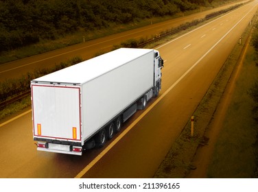 White truck on the highway. Picture with space for your text. - Shutterstock ID 211396165