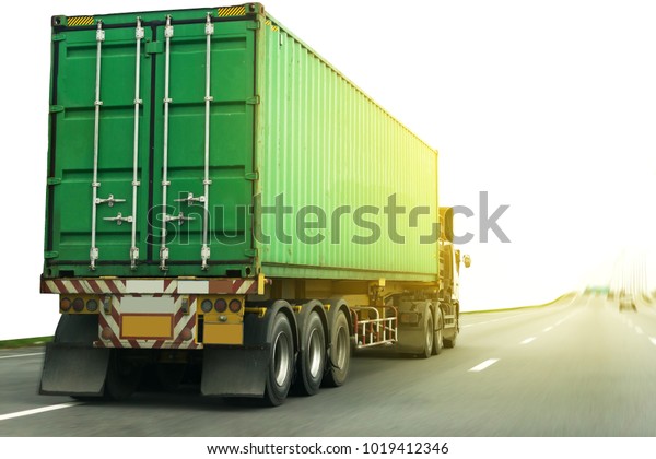 White Truck on\
highway road with green  container, transportation\
concept.,import,export logistic industrial Transporting Land\
transport on the asphalt\
expressway