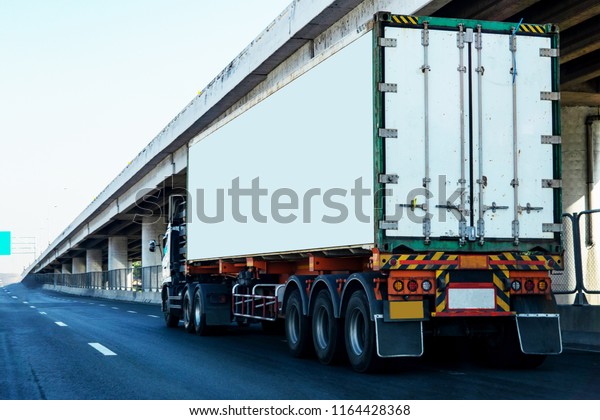 White Truck on\
highway road with  container, transportation concept.,import,export\
logistic industrial Transporting Land transport on the asphalt\
expressway