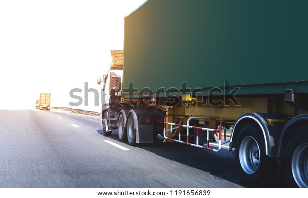 White Truck on\
highway road with green  container, transportation\
concept.,import,export logistic industrial Transporting Land\
transport on the asphalt\
expressway