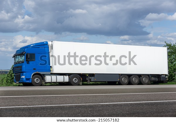 white truck on road.\
cargo transportation
