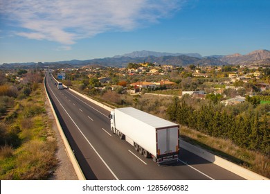 White Truck On The Road. Top View Of The Road. Shipping Place For Text. Freight Transport. Highway. Perspective. Motorway. Mock Up.