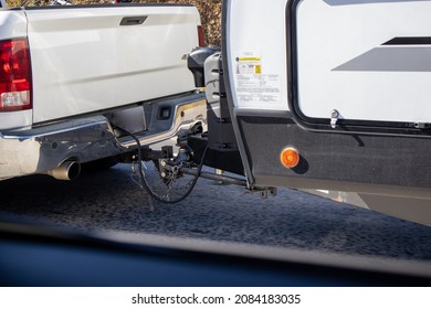 White Truck Towing A Camper Rv