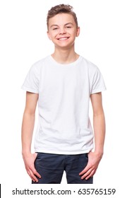 White T-shirt On Teen Boy. Handsome Caucasian Smiling Child, Isolated On A White Background. Concept Of Childhood And Fashion Or Advertisement Design. Mock Up Template For Design Print.