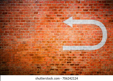 White Turnaround Sign On Vintage Brick Wall, Decision Making Concept