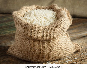 White Uncooked Basmati Rice In Burlap Bag 