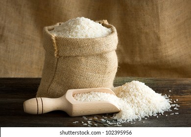 White Uncooked Rice In Burlap Bag