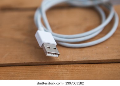 White USB Cable (USB Chord) On A Wooden Ground, Close Up