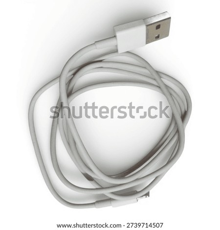 A white USB cable is coiled up with the connector end visible on a white background The cable is neatly wrapped around itself several times The USB connector is silver and rectangular with a white casing The cable appears to be made of a flexible plastic material