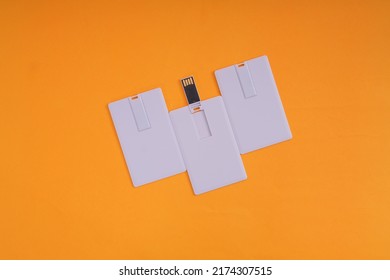 White USB Flash Disk Card On Orange Background