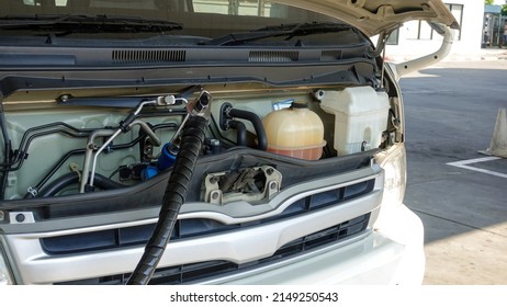 The White Van Is Filling NGV Or LPG In The Gas Pump