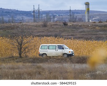 The white van rides somewhere down the road