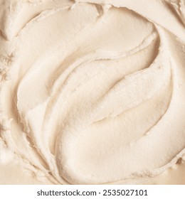 White vanilla ice cream texture as background. Homemade fresh frozen vanilla ice cream, sorbet closeup, rich cosmetic cream body butter texture.