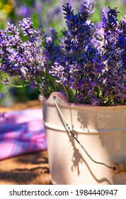 White Vase With Lavender Bouquet On Wooden, On Lavender Field Background