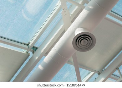 White ventilation pipe on the polycarbonate transparent ceiling. Copy space. 