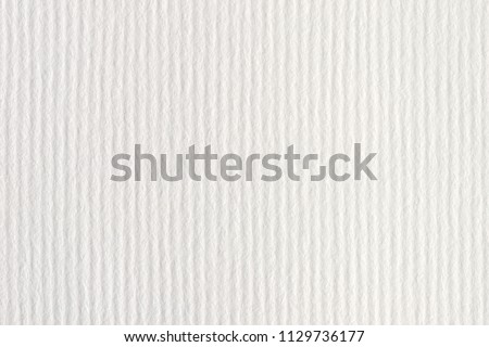 White  vertical striped embossed paper surface for background. White striped embossed paper texture.