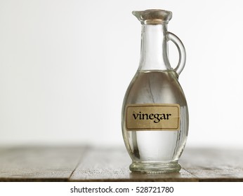 white vinegar on the wooden table top