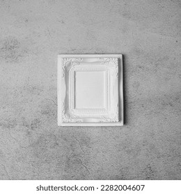 White vintage plaster frame on a concrete gray wall. Minimal crative composition. Copy space. - Shutterstock ID 2282004607