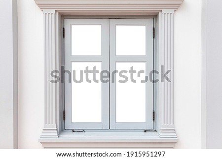 White vintage wooden window frame and white plaster wall 