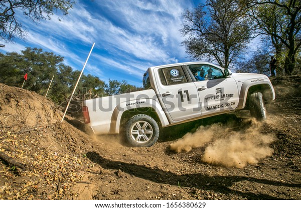 A white Volkswagen\
Amarok  off roading at the  2015 Spirit of Amarok Amateur, 4x4\
driving competition held in Botswana, Tuli Block at Kwalata Game\
Lodge   September 16 2015