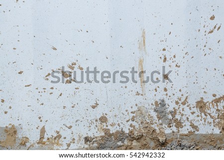 white wall cement dirty with muddy splashing in construction site building industry