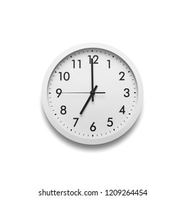 White Wall Clock Isolated On White Background. On The Clock, Seven O'clock.