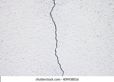 White Wall With Cracks In The Middle, Split Down The Middle.