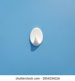 White wall hanger isolated on blue background. - Powered by Shutterstock