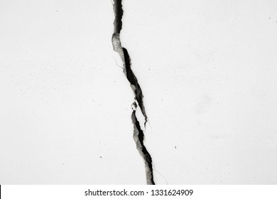 White Wall Of House Is Divided By Huge Crack. The Collapse Of Wall. Seismic Activity, Earthquake.