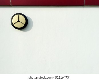 White wall with industrial style lamp and red bricks on top. Background image. - Powered by Shutterstock