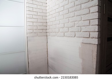 White Wall Made Of Decorative Stone In The Form Of A Brick. Laying Gypsum Bricks During Apartment Renovation.