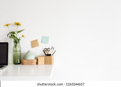 White Wall Mock Up Supplies, Floweres In Vase On Bookshelf Or Desk.
