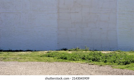 White Wall On An Empty Plot