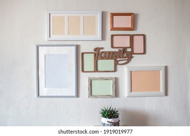 White Wall With Set Of Different Empty Vertical And Horizontal Picture Frames To Create Family Photo Gallery On The Wall, To Capture A Moment, Mockup Template On The White Background, Lifestyle