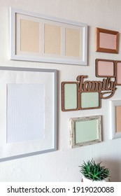 White Wall With Set Of Different Empty Vertical And Horizontal Picture Frames To Create Family Photo Gallery On The Wall, To Capture A Moment, Mockup Template On The White Background, Lifestyle