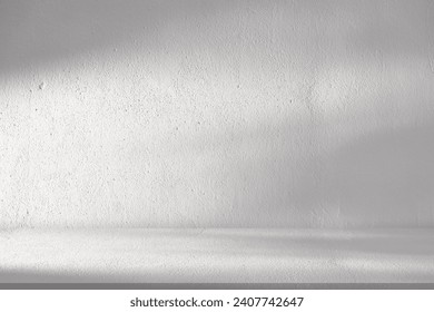 White Wall Studio Background.Empty Grey Room Background with Light, Leaves Shadow on Table Top Surface Texture,Backdrop Mockup Display Podium Design for displaying product present of Cosmetic Banner - Powered by Shutterstock