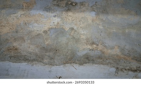 The white wall surface is damaged due to moisture and the paint becomes rough and changes color, the wrong choice of paint for the building.