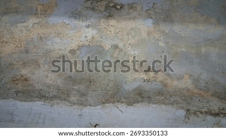 The white wall surface is damaged due to moisture and the paint becomes rough and changes color, the wrong choice of paint for the building.